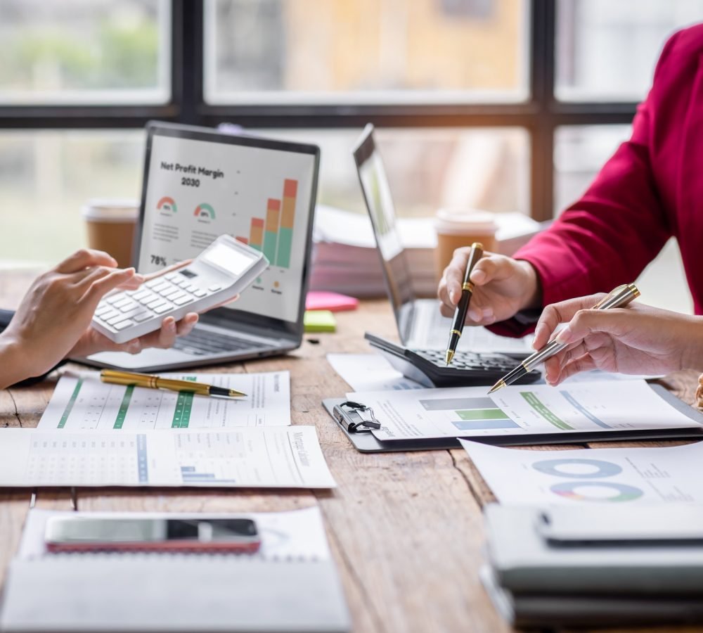 group-of-confident-business-people-point-to-graphs-2025-02-21-02-31-12-utc